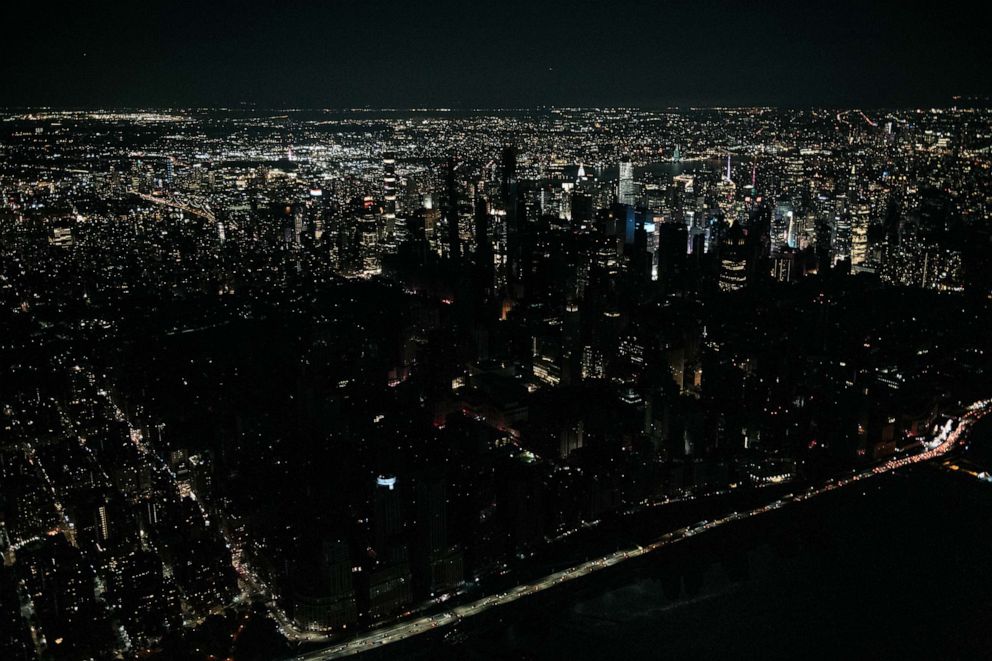 PHOTO: Seen from the air, a large section of Manhattan's Upper West Side and Midtown neighborhoods sit coated in darkness during a partial blackout, July 13, 2019 in the Manhattan borough of New York City.