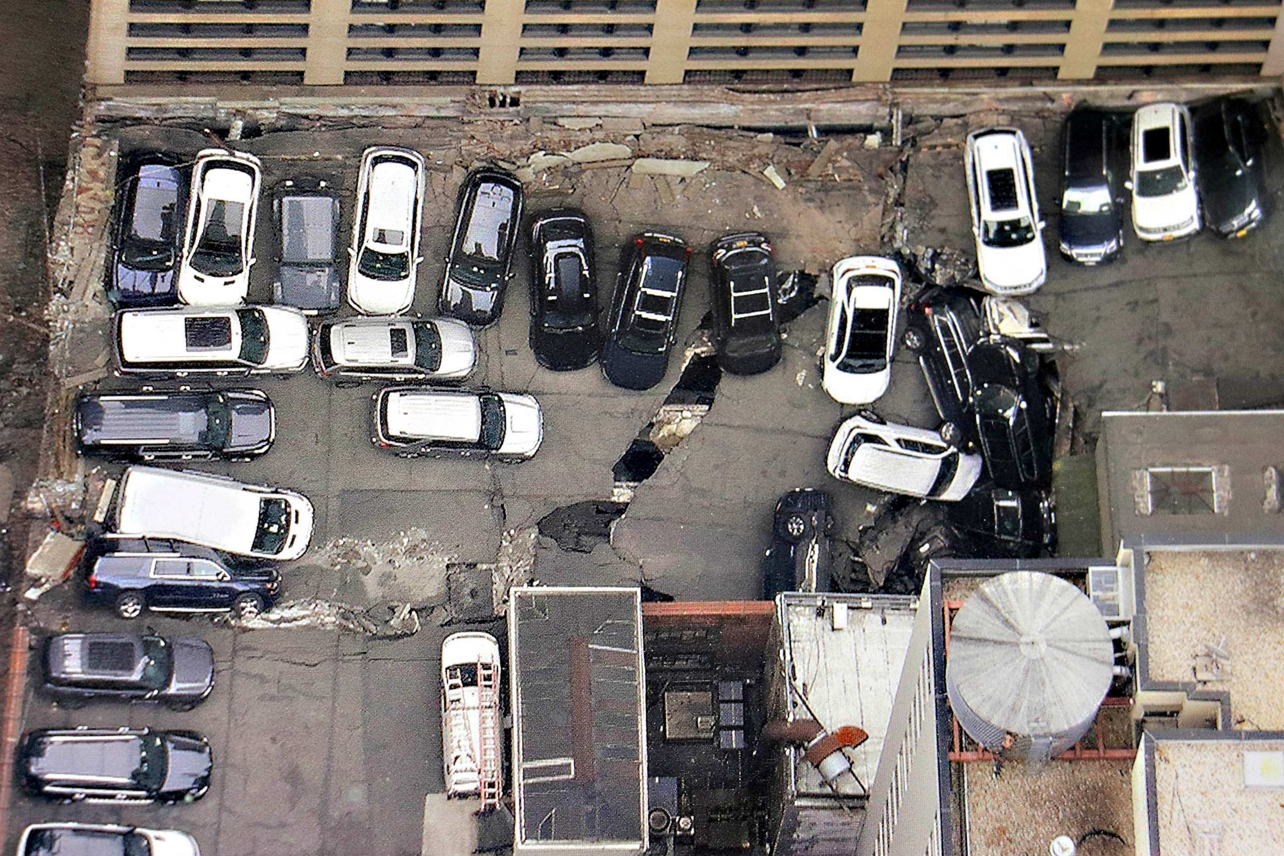 PHOTO: Cars are seen at the partial collapse of a parking garage in the Financial District of New York, April 19, 2023, in New York.