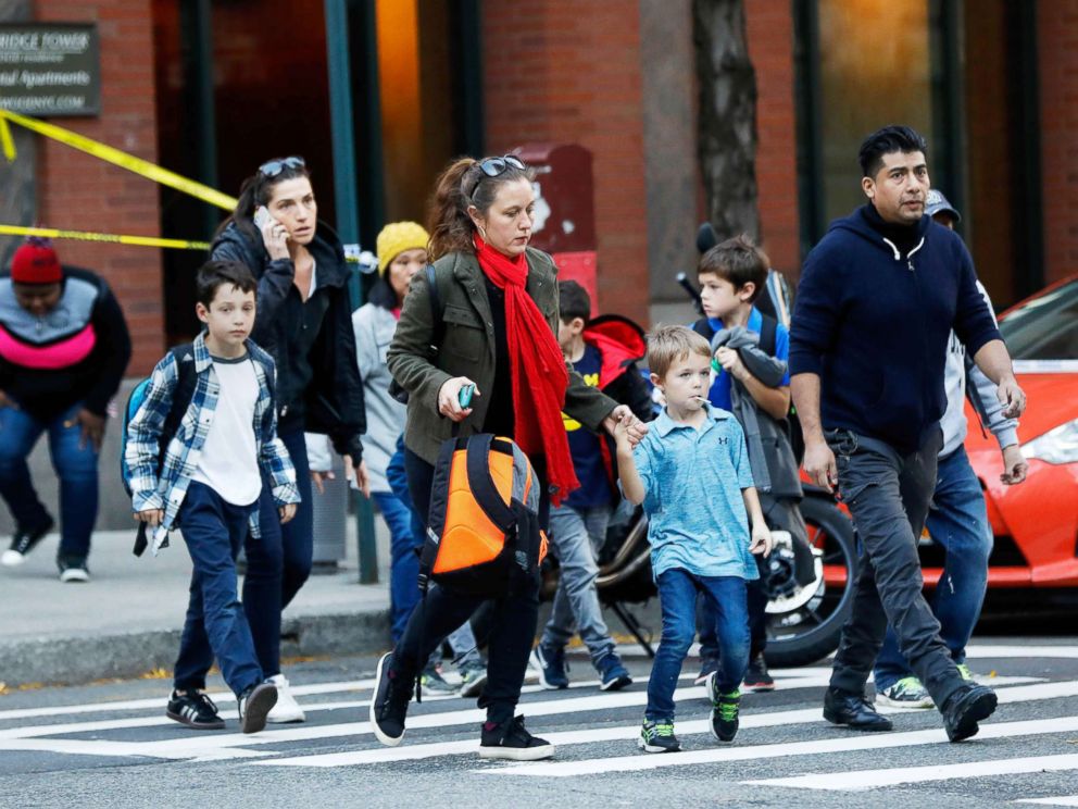 PHOTO: Parents pick up their children from P.S./I.S.-89 school after a truck struck people on a bike path in New York City, Oct. 31, 2017.
