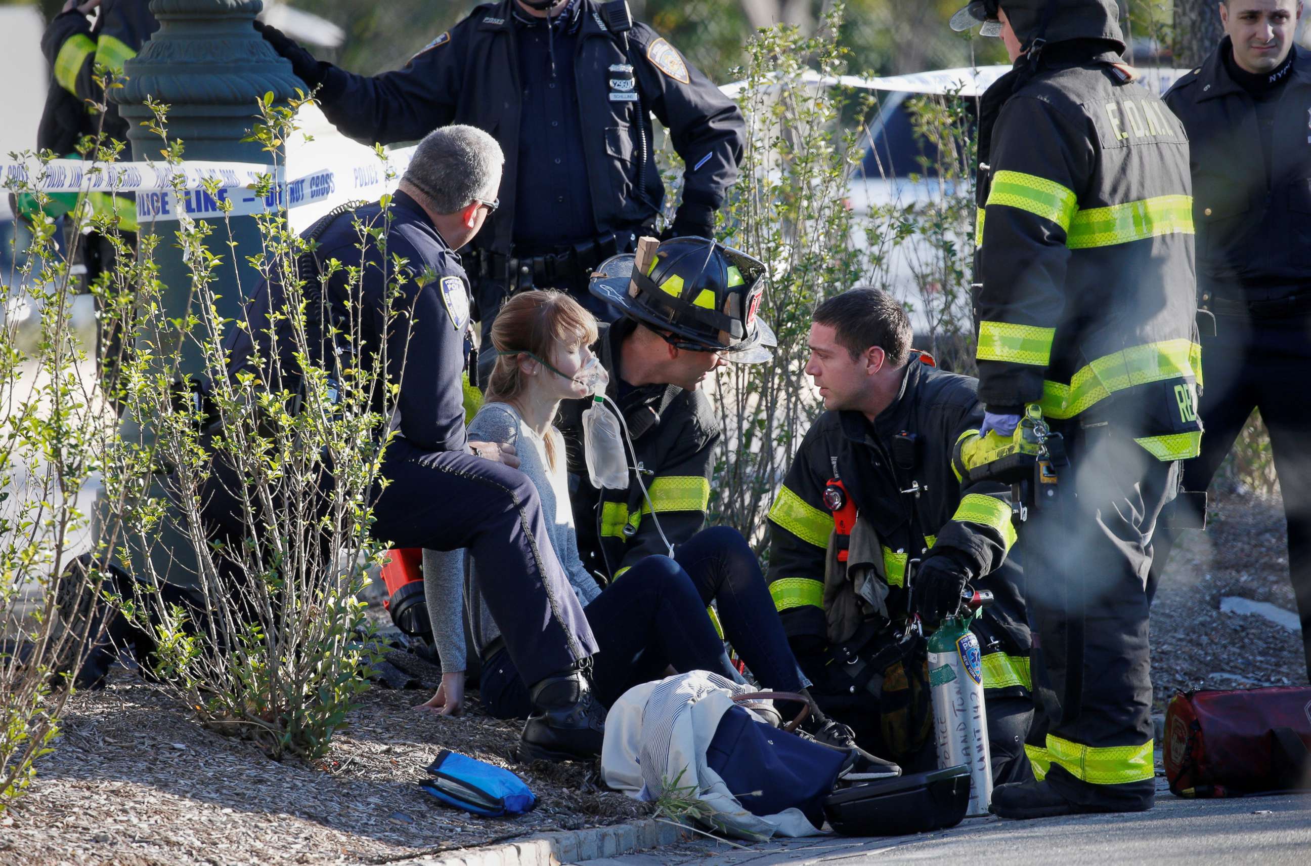 PHOTO: A woman is aided by first responders after sustaining injury on a bike path in lower Manhattan in New York, NY, Oct. 31, 2017.