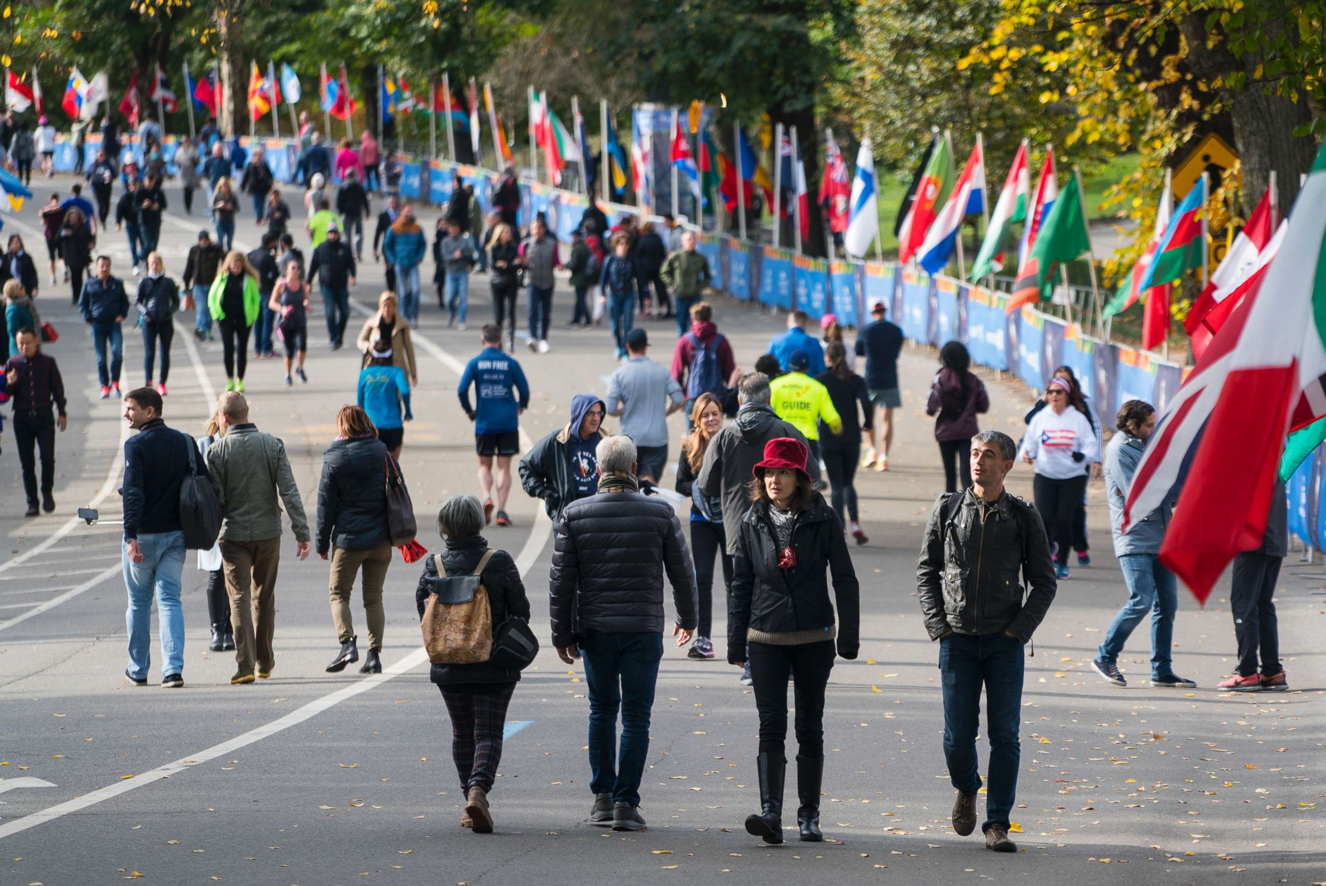 PHOTO: Pedestrians and runners move along Central Park's West Drive in New York as they come together near the finish line area of the New York City Marathon, Nov. 4, 2017, one day before the race hosts thousands of participants from around the world.