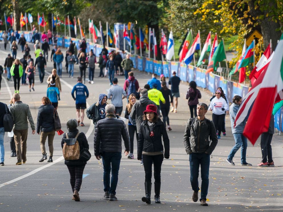 PHOTO: Pedestrians and runners move along Central Park's West Drive in New York as they come together near the finish line area of the New York City Marathon, Nov. 4, 2017, one day before the race hosts thousands of participants from around the world.