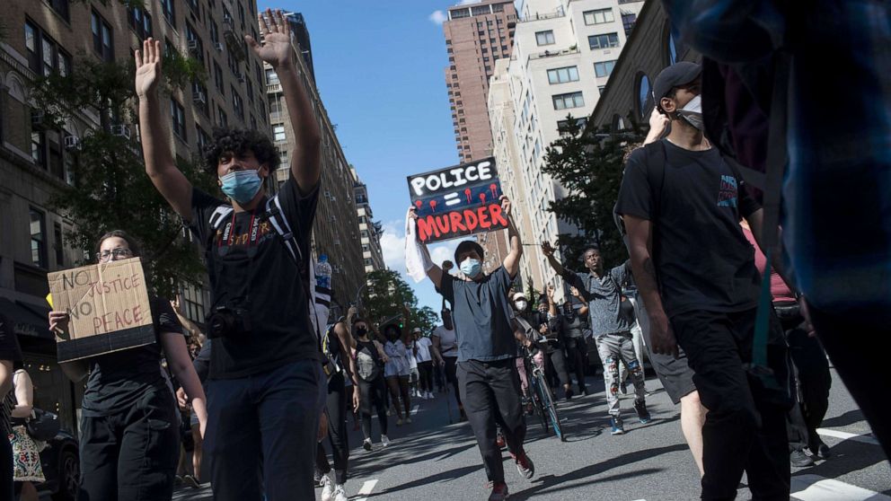 PHOTO: Protesters march during a solidarity rally for George Floyd, May 30, 2020, in New York.