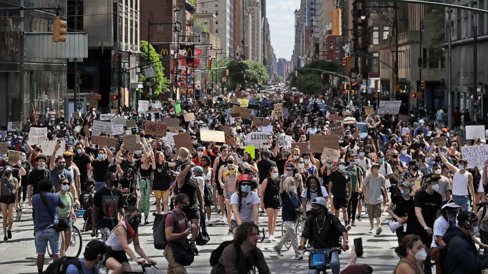 PHOTO: Protesters march through the streets of Manhattan, New York, June 7, 2020, against police brutality after the death in police custody in Minneapolis of George Floyd.