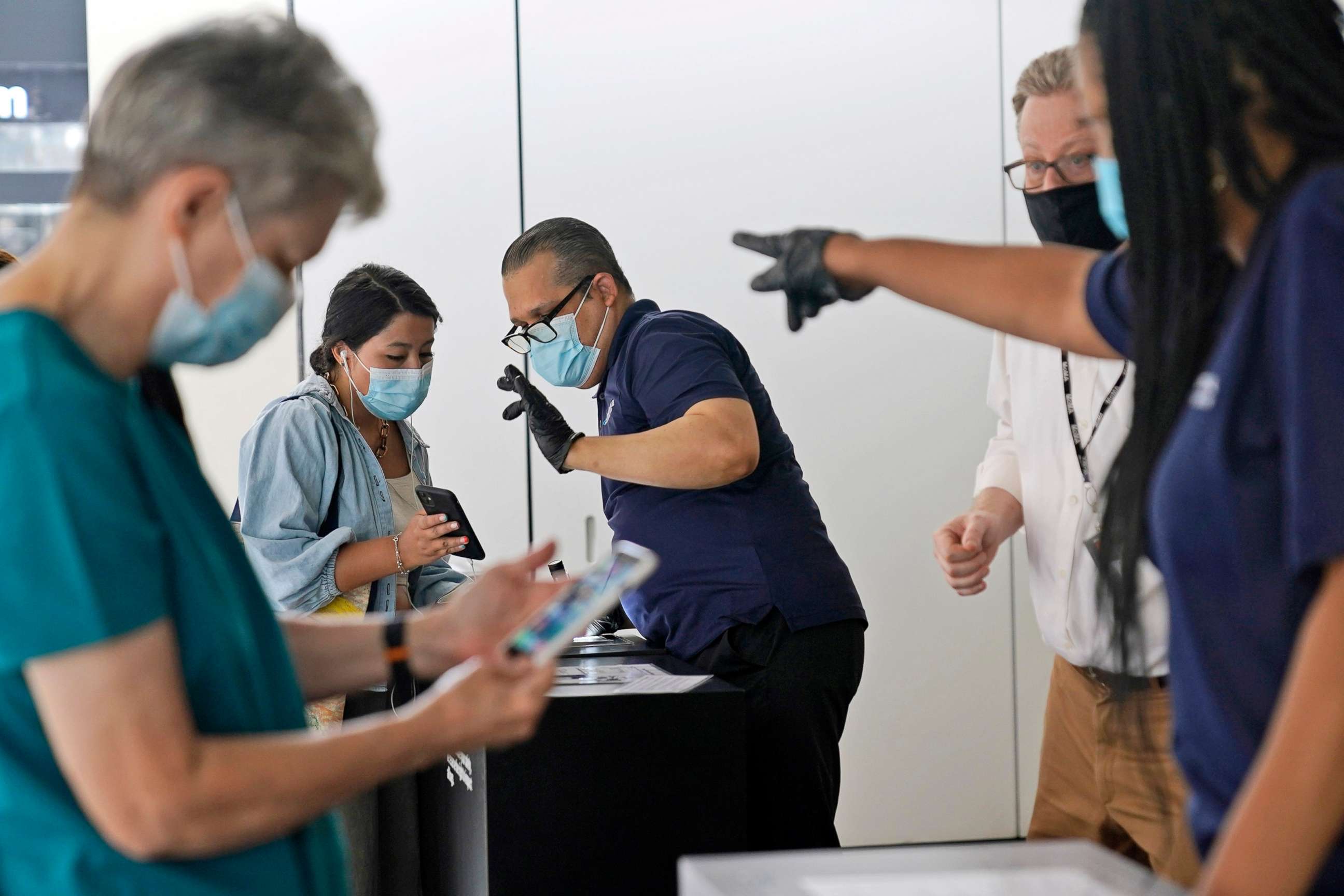 PHOTO: Staff at the Modern Museum of Art check visitors' proof of vaccination in New York, Sept. 13, 2021.