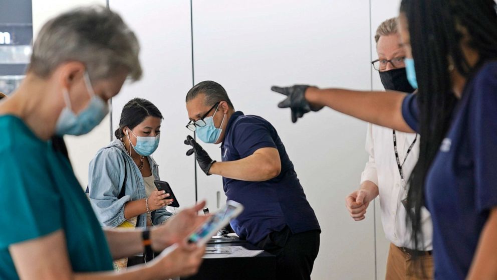 PHOTO: Staff at the Modern Museum of Art check visitors' proof of vaccination in New York, Sept. 13, 2021.