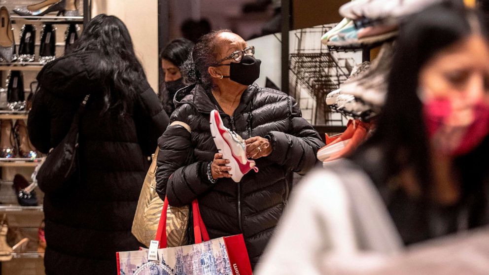 PHOTO: Shoppers walk through the aisles at Macy's, Nov. 26, 2021, in New York.