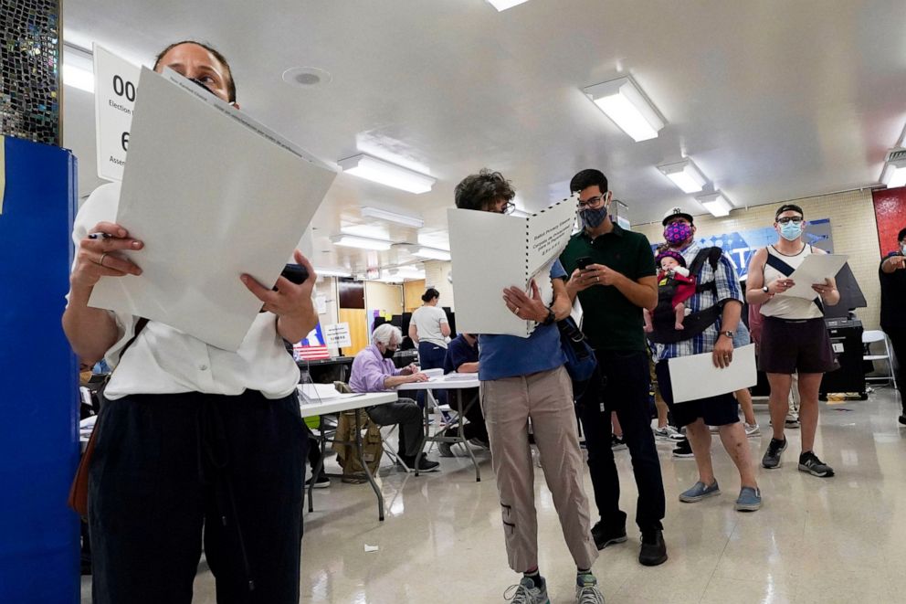PHOTO: Voters wait to mark their ballots at Frank McCourt High School, in New York, Tuesday, June 22, 2021.