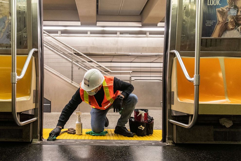 PHOTO: A Metropolitan Transportation Authority worker cleans a subway car during the outbreak of the novel coronavirus in New York City on May 5, 2020.