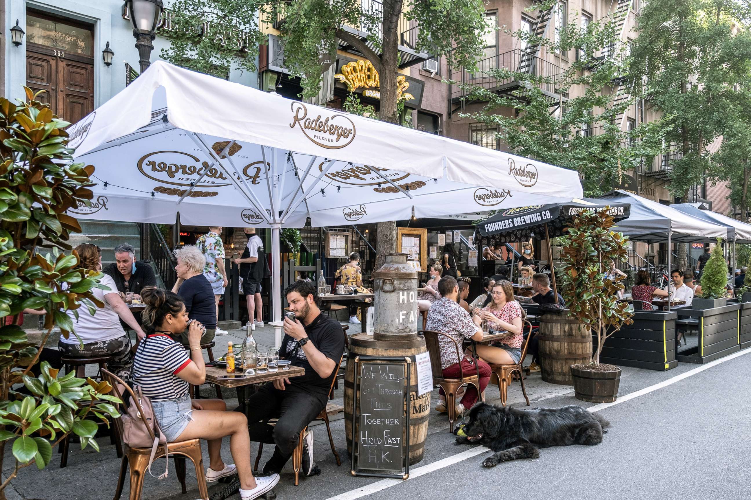 PHOTO: People enjoy al fresco dining at a bar as the coronavirus kept restaurants from offering indoor dining, July 5, 2020, in New York City.