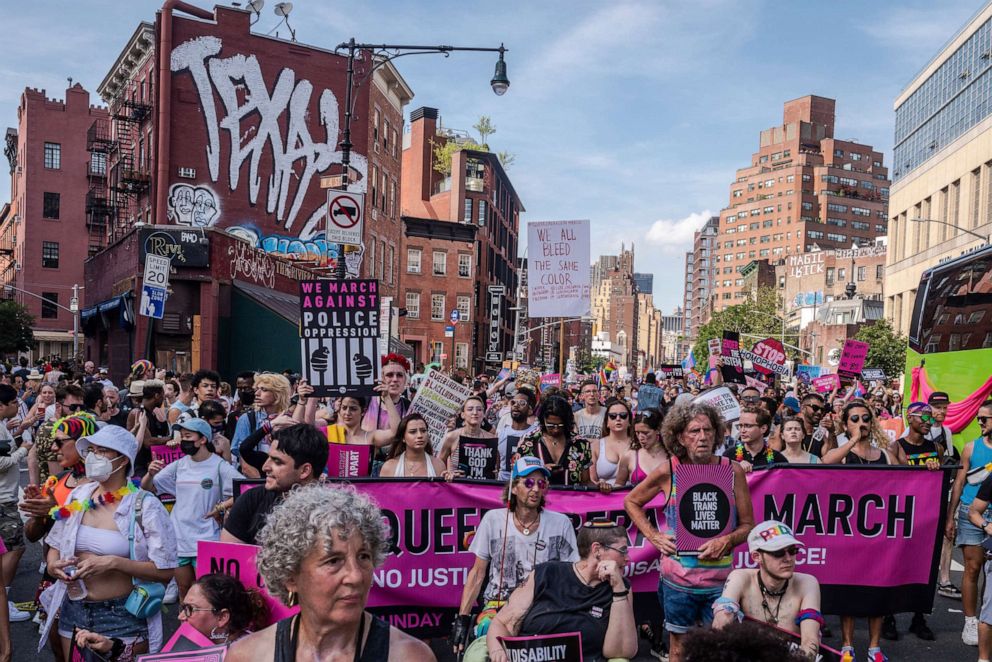 PHOTO: People with and without masks participate in a pride parade in New York, June 27, 2021.