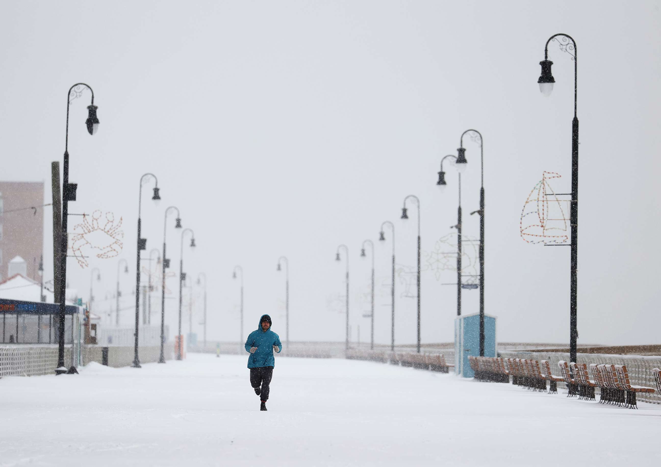 PHOTO: A man runs along the boardwalk on Dec. 17, 2020, in Long Beach, New York.