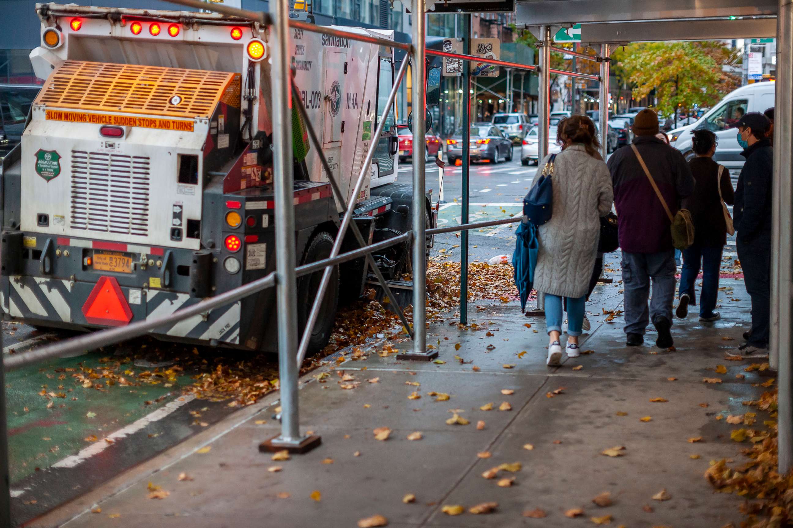 PHOTO: A NYC Dept. of Sanitation street sweeper gathers up fall foliage in the Chelsea neighborhood of New York City, Nov. 13, 2021/