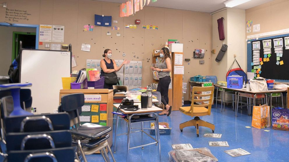 PHOTO: Teachers Nancy Rastetter and Marisa Wiezel discuss plans for the 2020/2021 school year in Wiezel's classroom at Yung Wing School P.S. 124, Aug. 25, 2020 in New York City.