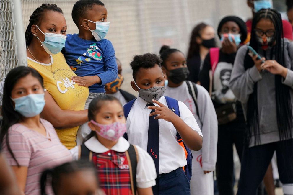 PHOTO: Students wear protective masks as they arrive for classes at the Immaculate Conception School while observing COVID-19 prevention protocols, as some private schools reopened, in The Bronx borough of New York City, Sept. 9, 2020.