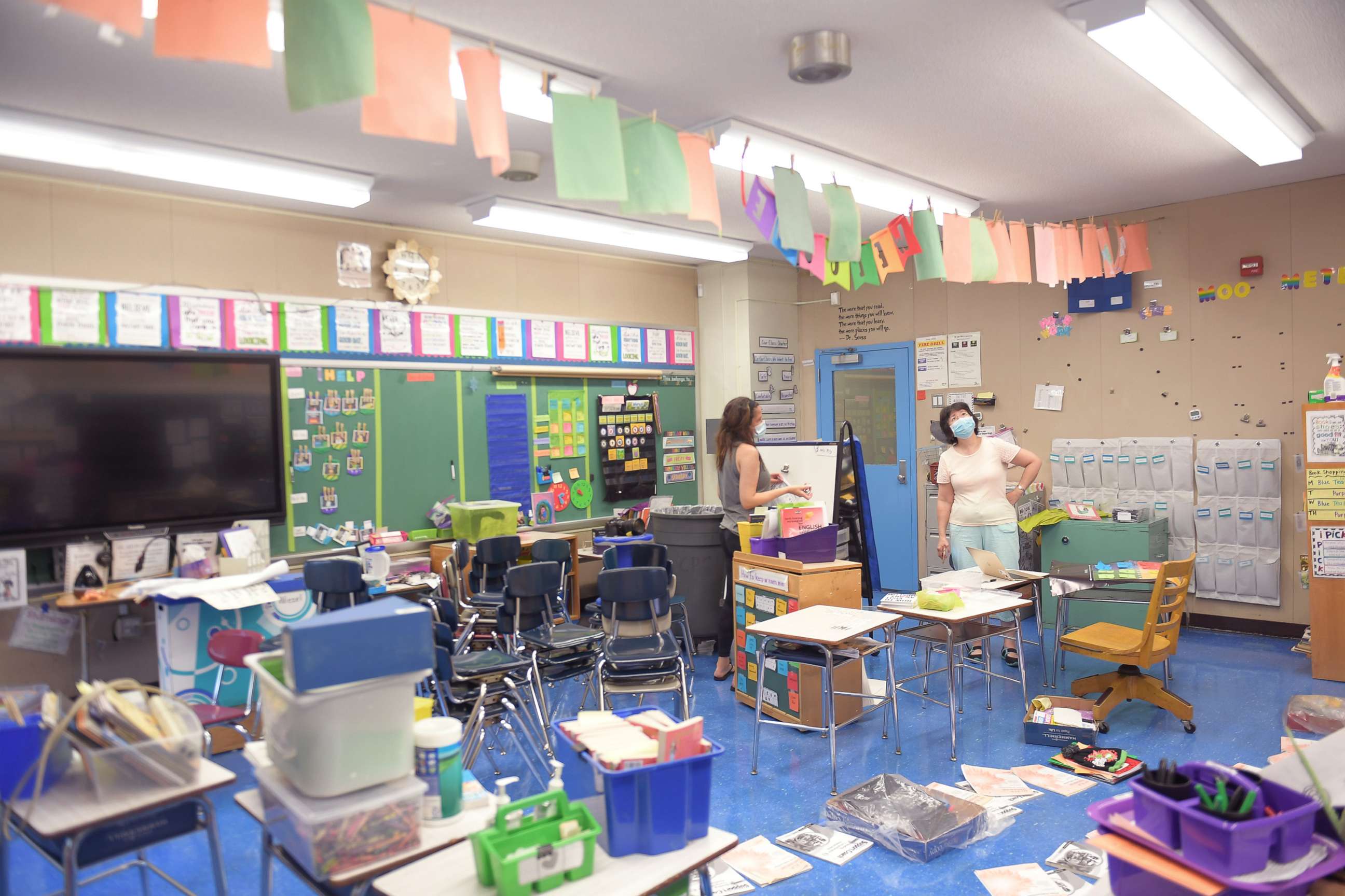 PHOTO: Teacher Marisa Wiezel and principal Alice Hom discuss plans for the school year in Wiezel's classroom at Yung Wing School P.S. 124 in New York, Aug. 25, 2020.