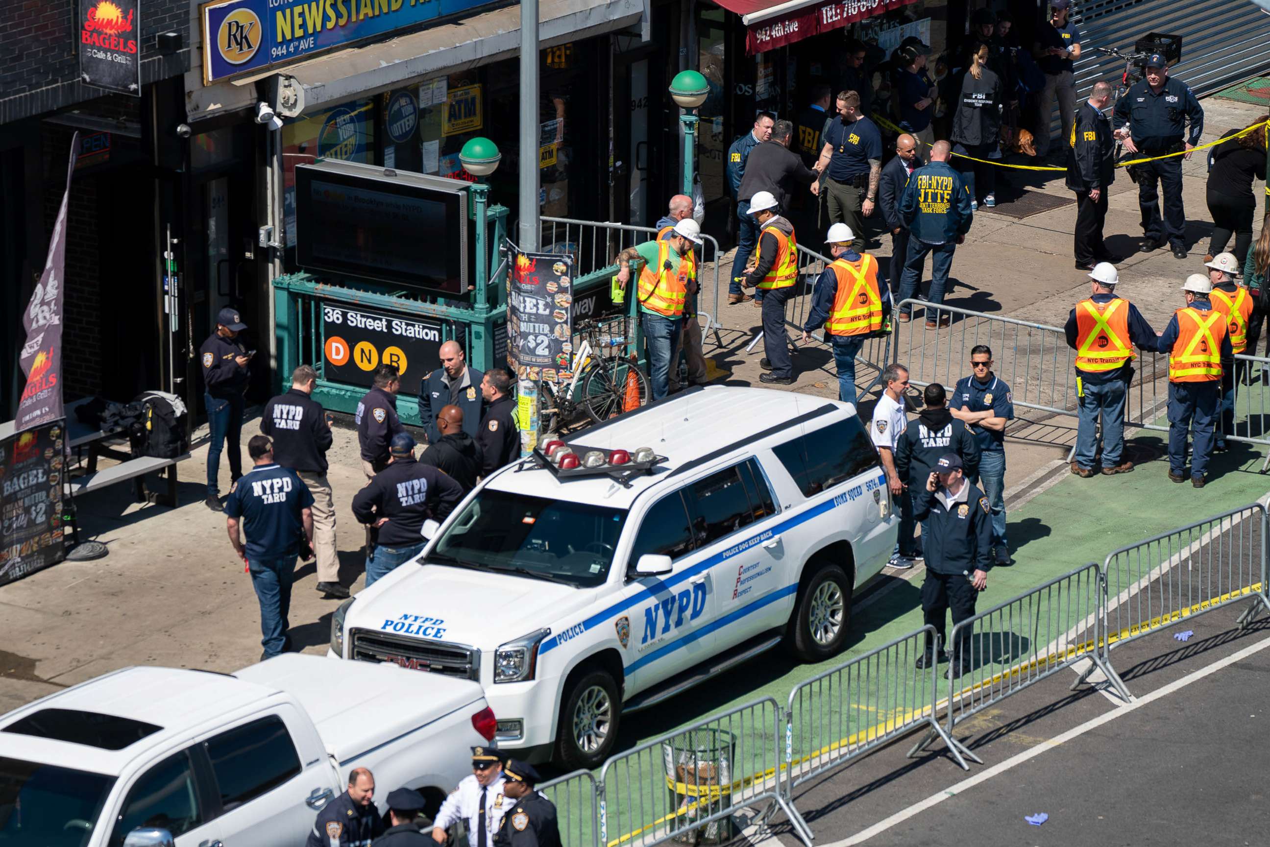 PHOTO: Members of the NYPD gather at the site of a shooting at the 36 St subway station, April 12, 2022 in New York City.