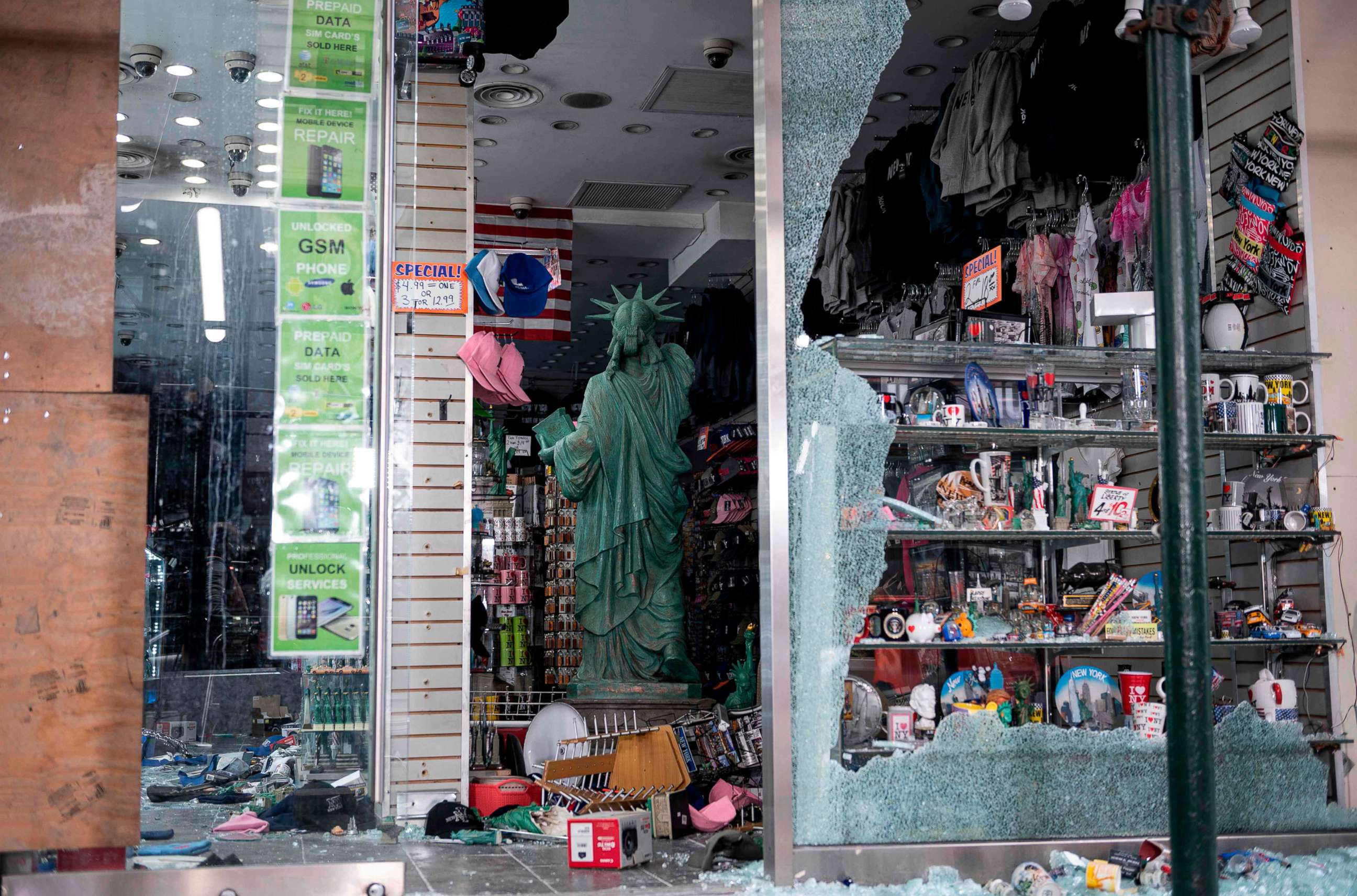 PHOTO: A looted souvenir shop is seen after a night of protest over the death of George Floyd, June 2, 2020 in New York City.