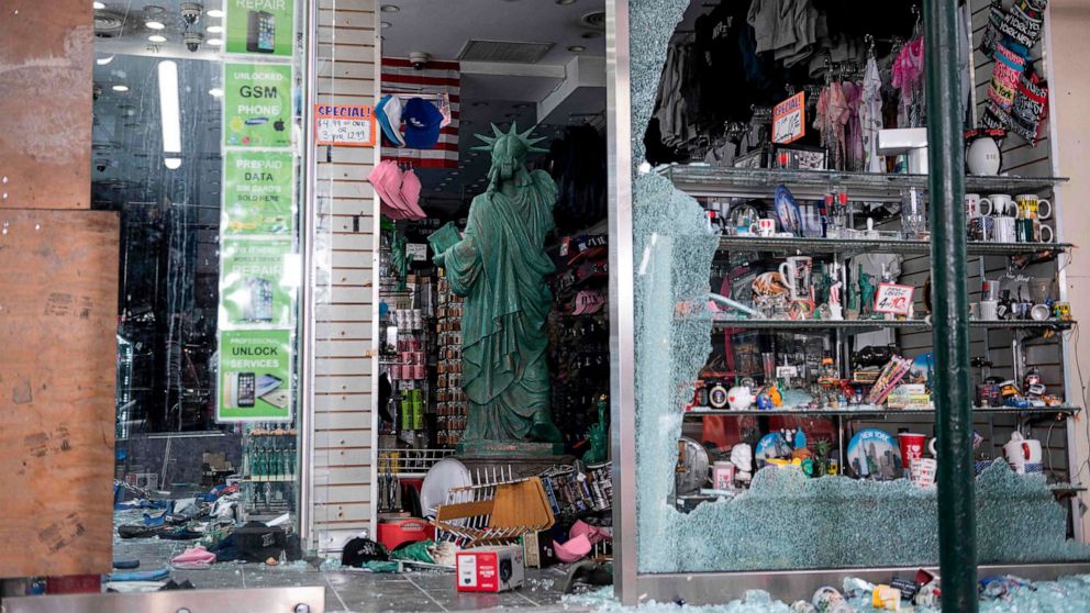 PHOTO: A looted souvenir shop is seen after a night of protest over the death of George Floyd, June 2, 2020 in New York City.