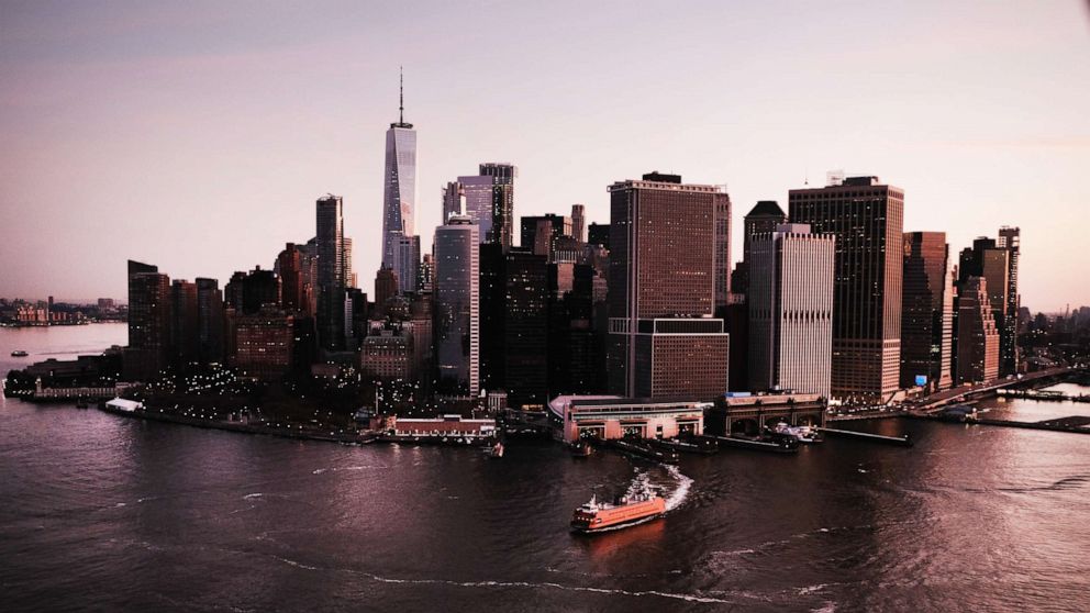 PHOTO: Dawn breaks over Manhattan as the New York City struggles to contain the number of coronavirus cases, on March 18, 2020.