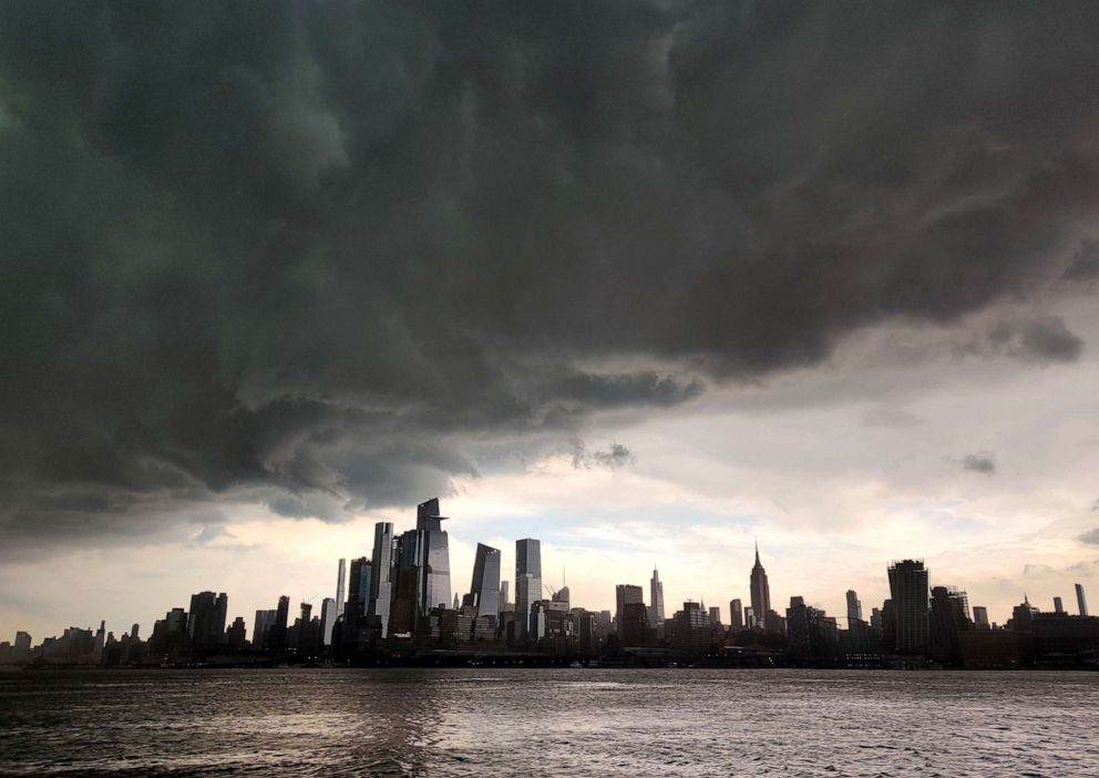 PHOTO: A thunderstorm moves across the Hudson River from New Jersey over midtown Manhattan, June 4, 2021, as seen from Hoboken, New Jersey.