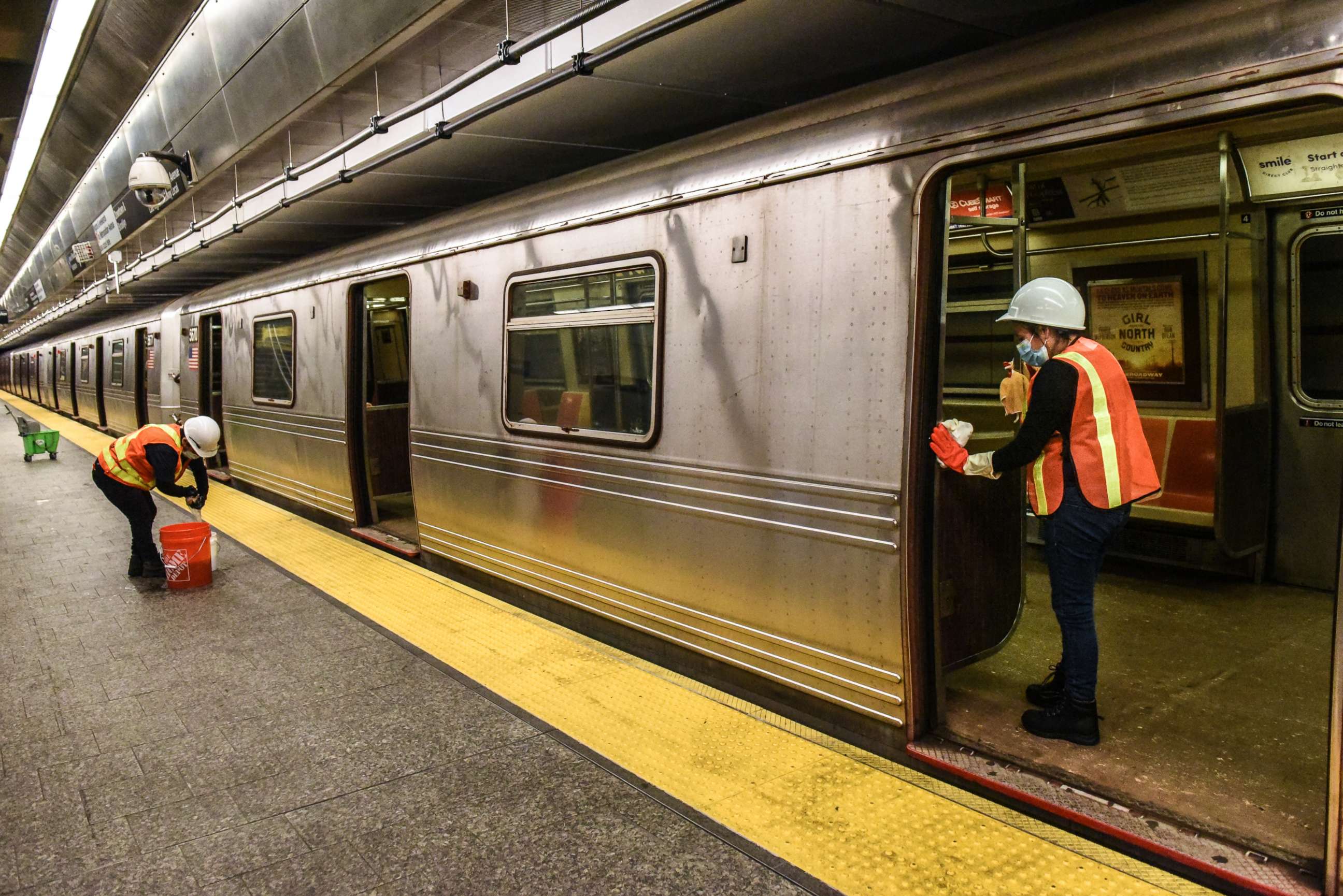 PHOTO: A cleaning crew disinfects a New York City subway train on May 4, 2020 in New York.