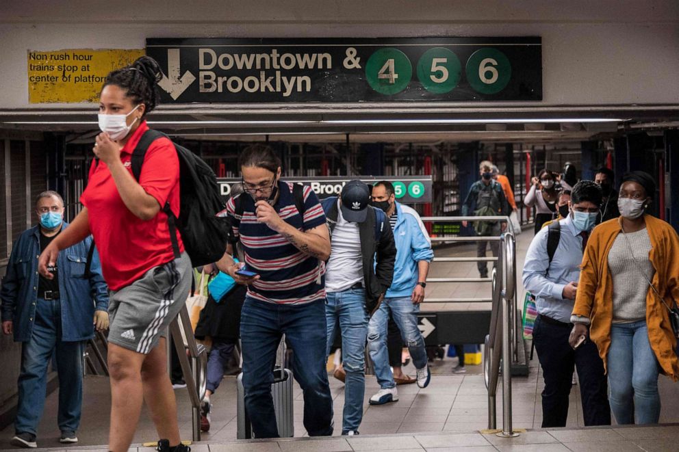 PHOTO: People commute as the subway returns to twenty-four hour service, May 17, 2021, in New York City.