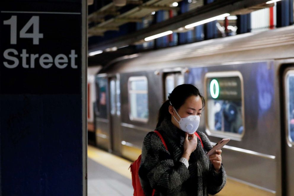 PHOTO: A woman wears a face mask as she waits on the subway in Manhattan borough of New York City, U.S., on March 2, 2020, after the first confirmed case of coronavirus was announced in New York state.
