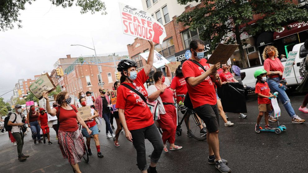 PHOTO: Members of the teachers union, parents and students participate in a march through Brooklyn to demand a safer teaching environment for themselves and for students during the Covid-19 pandemic, Sept. 1, 2020, in New York City.