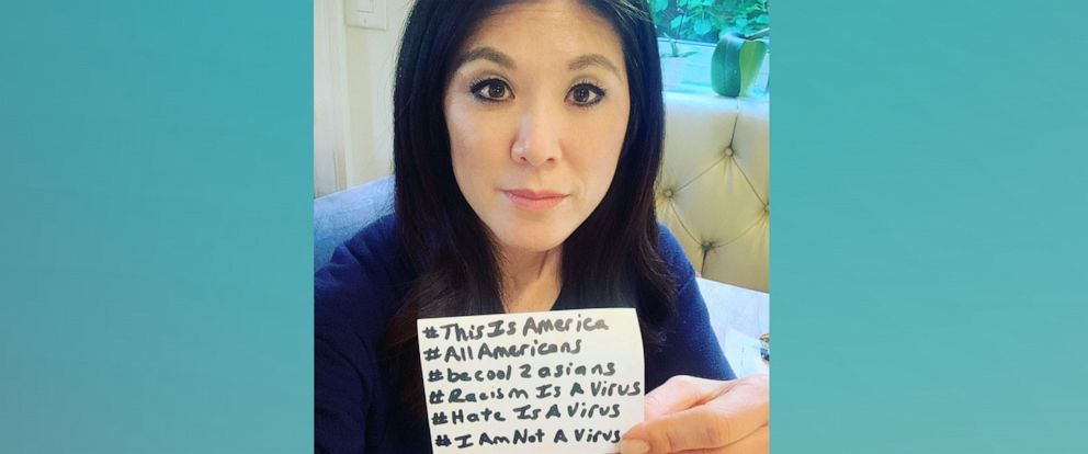 PHOTO: Journalist Nydia Han holds up several hashtags used to bring awareness to Asian American discrimination.