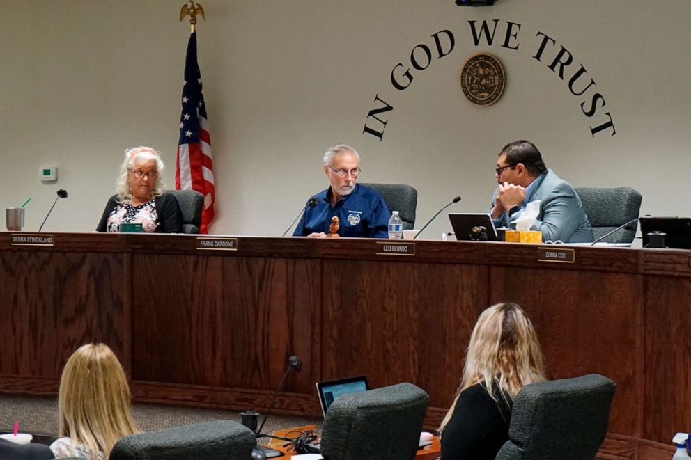 PHOTO: In this July 19, 2022, file photo, Nye County Commissioners Debra Strickland, Frank Carbone and Leo Blundo discuss appointing a new county clerk, in Pahrump, Nev.