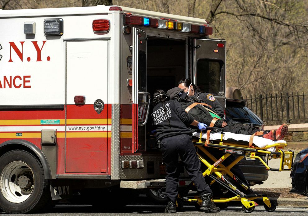 PHOTO: NYFD EMT personnel load a patient into an ambulance in New York on April 2, 2020.