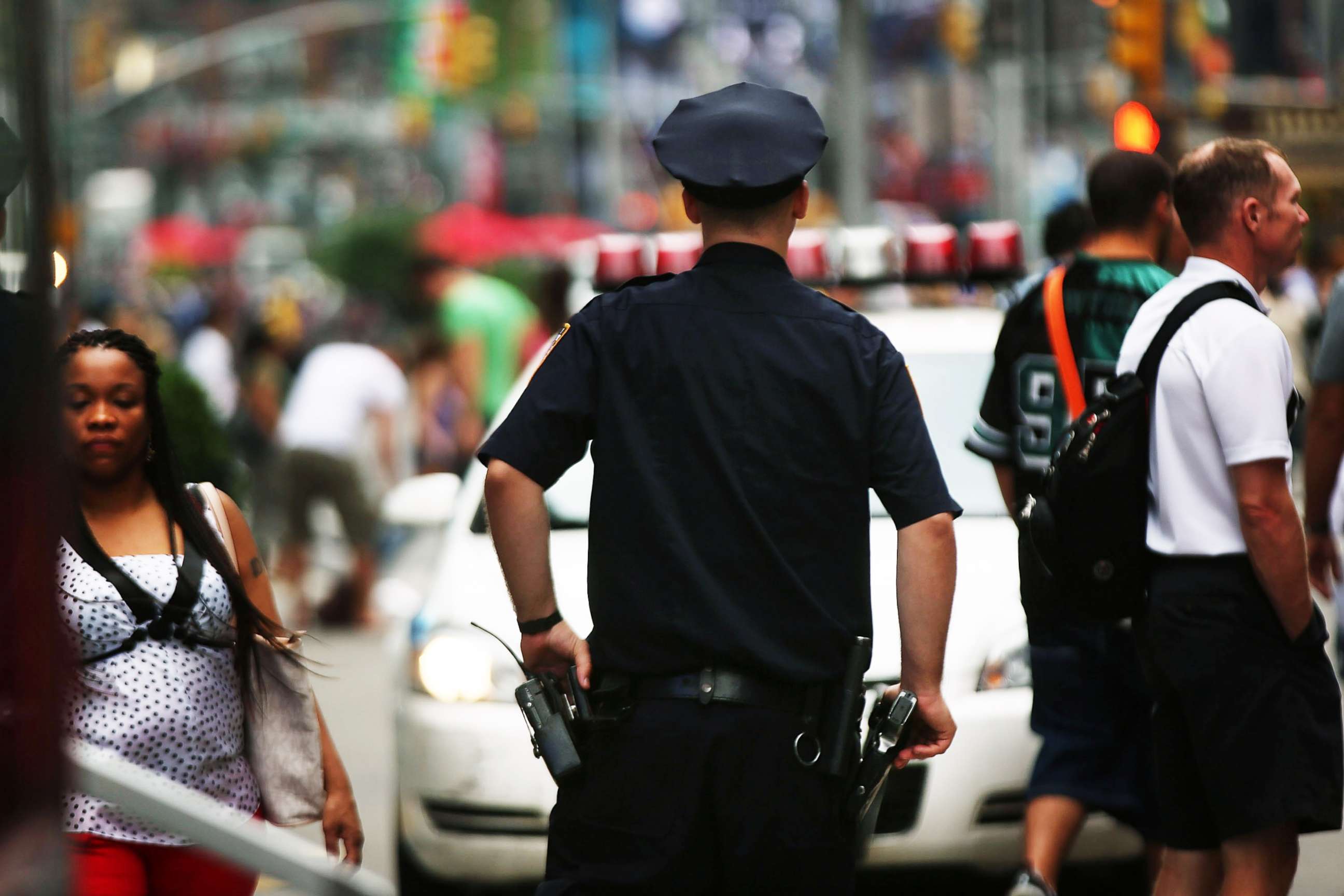 PHOTO: A New York City police officer stands in Times Square on Aug. 12, 2013, in New York.