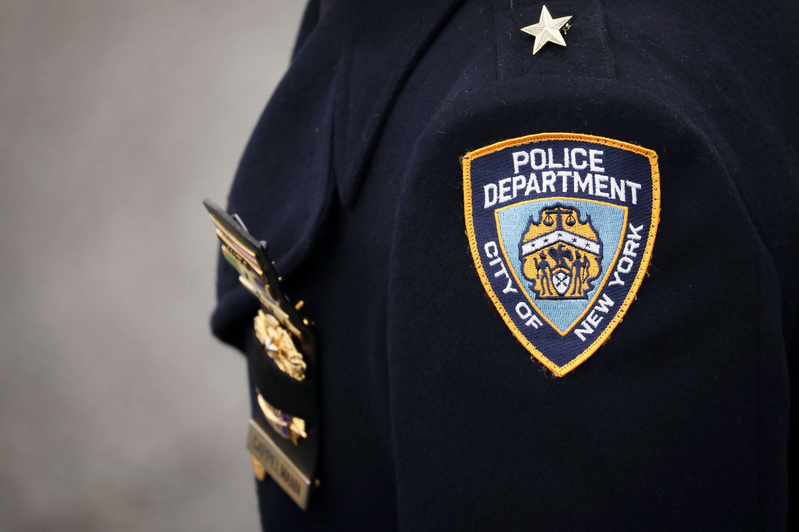 PHOTO: An NYPD officer arrives for the funeral service of fallen NYPD Detective.