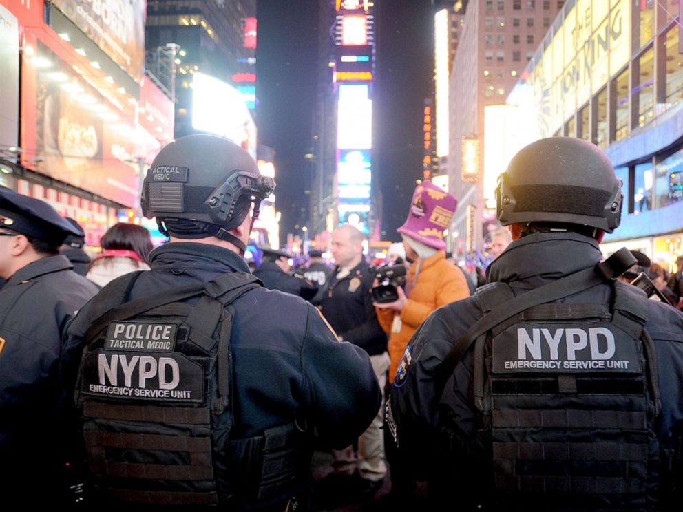 PHOTO: In this Dec. 31, 2015, file photo, NYPD Emergency Service Unit officers watch over revelers in Times Square on New Years Eve in New York.