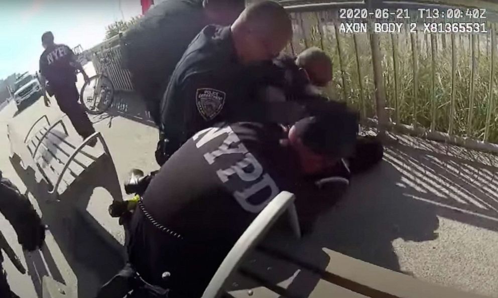 PHOTO: In this photo taken from video, New York Police officers arrest a man on a boardwalk, June 21, 2020, in New York.