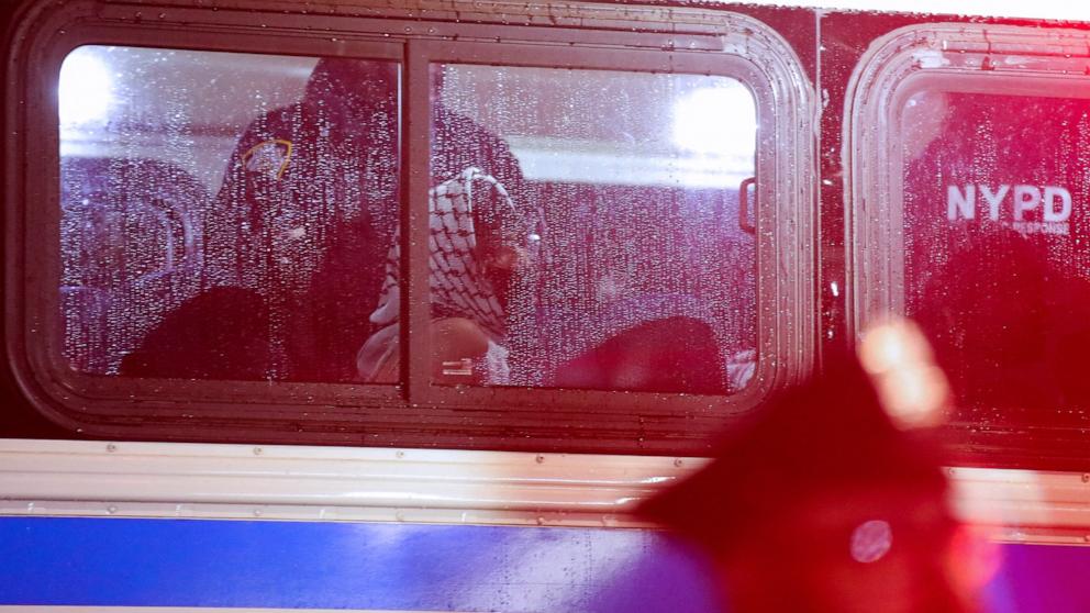 NYPD officers transport arrested students in a bus as they evict a building that had been barricaded by pro-Palestinian student protesters at Columbia University, in New York City on April 30, 2024. (Photo by LEONARDO MUNOZ/AFP via Getty Images)