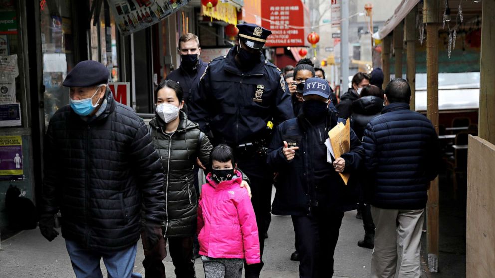 PHOTO: Members of the New York Police Department Community Affairs Rapid Response Team patrol through the Chinatown section of Manhattan, New York following the deadly shooting at three Georgia spas, March 17, 2021.