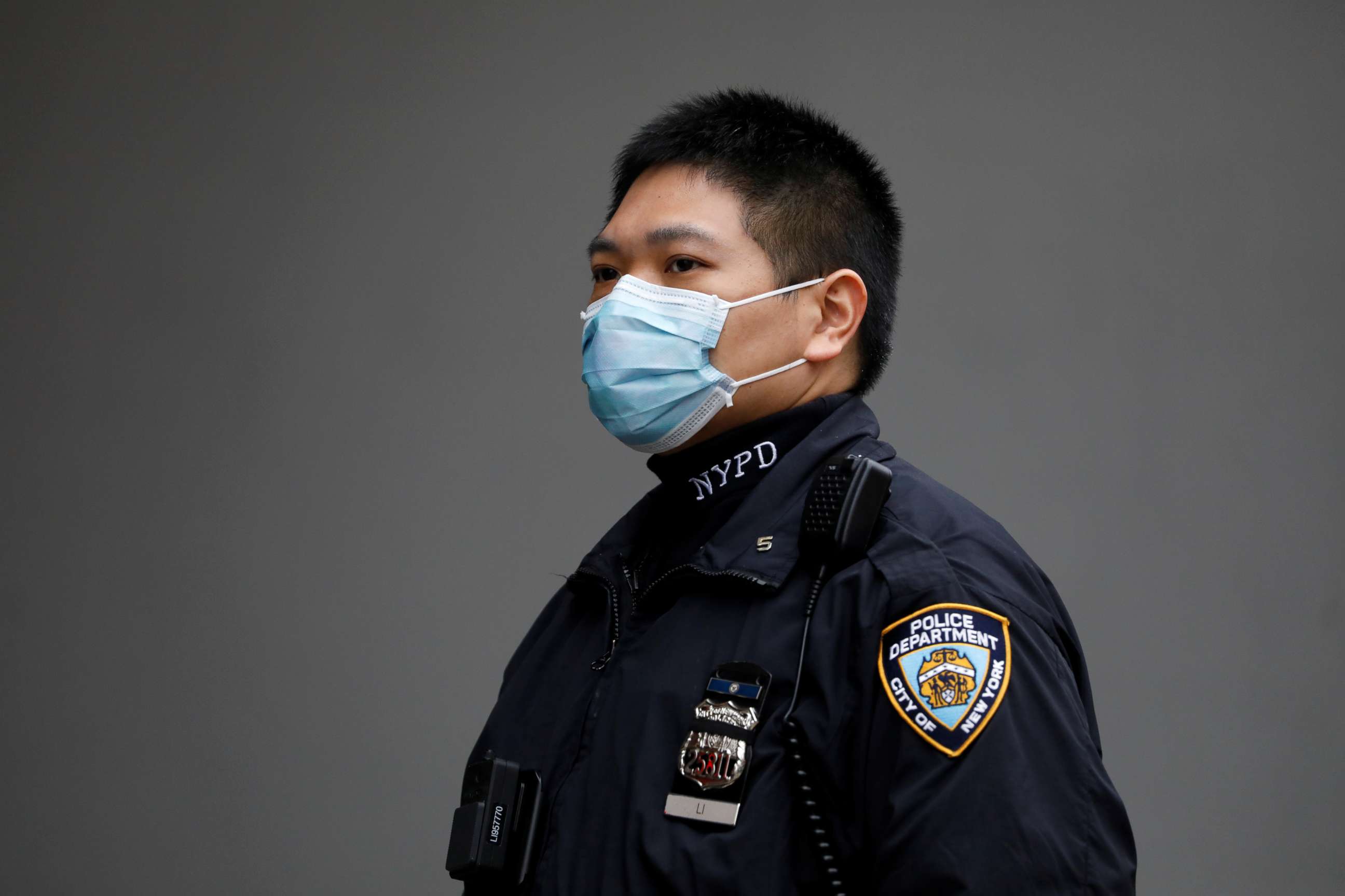 PHOTO: A New York Police Department officer is seen in a protective mask during the coronavirus disease outbreak in the Manhattan borough of New York, March 20, 2020.