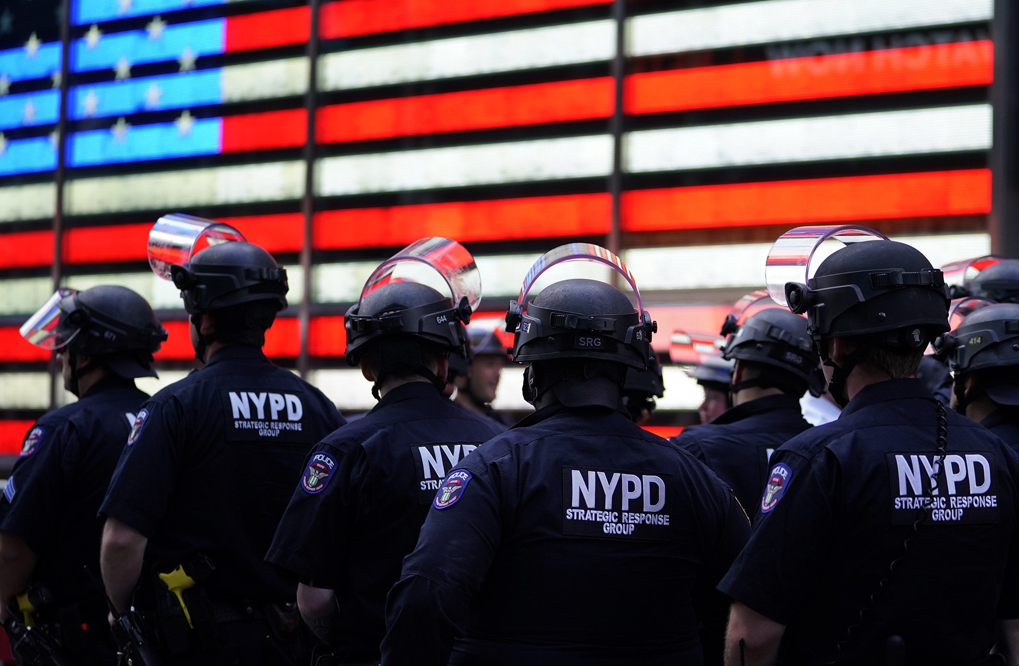 PHOTO: NYPD police officers watch demonstrators in Times Square in New York, June 1, 2020.