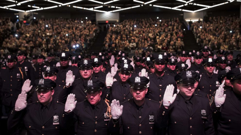 PHOTO: The newest members of the New York City Police Department are sworn-in during their police academy graduation ceremony at the Theater at Madison Square Garden, April 18, 2018 in New York.