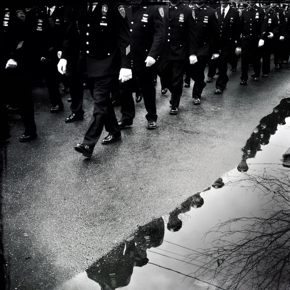PHOTO: Police officers march in formation during an officer's funeral, in New York, Jan. 4, 2015.