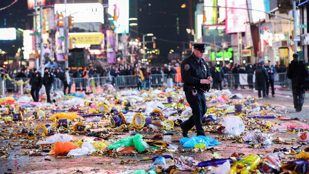  A constabulary  serviceman  walks aft  the archetypal  nationalist   New Year's lawsuit   since the COVID-19 pandemic, astatine  Times Square, successful  New York, Jan. 1, 2023.