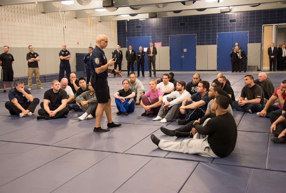 PHOTO: In this file photo, New York City Mayor Bill de Blasio and NYPD Commissioner Bill Bratton watch a demonstration of new police guidelines that will be taught to police officers at the Police Academy on December 4, 2014, in New York.