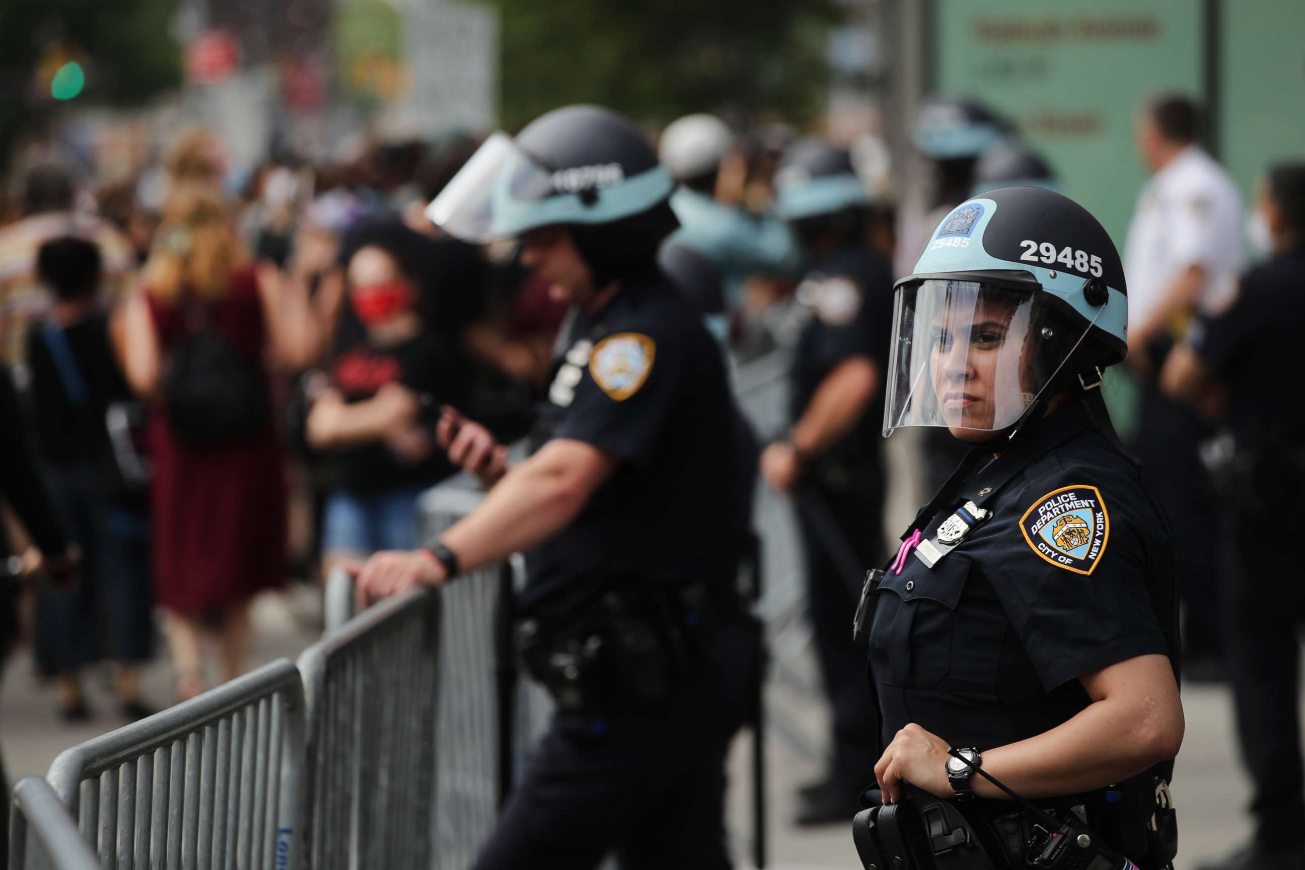 PHOTO: Police watch as hundreds of protesters march in downtown Brooklyn over the killing of George Floyd by a Minneapolis Police officer, June 05, 2020, in New York City.