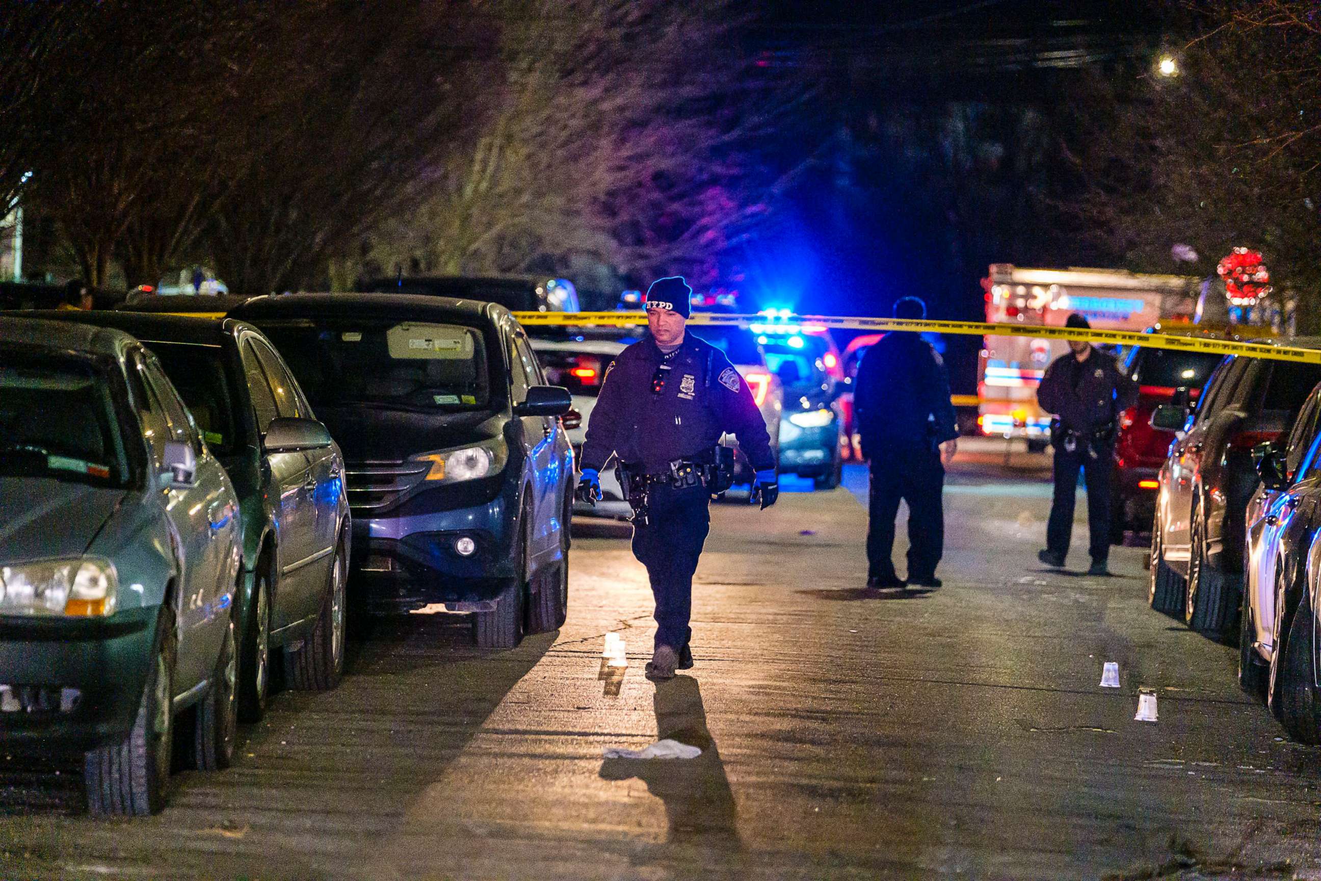 PHOTO: New York Police Department police search for evidence as they investigate the shooting of an off-duty police officer in Brooklyn, Feb. 4, 2023.