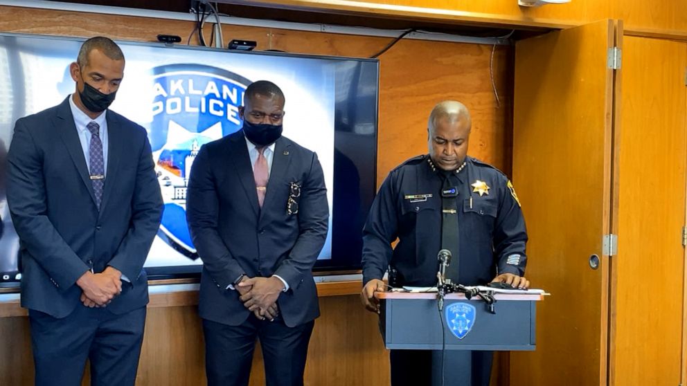 PHOTO: Oakland Police Chief LeRonne Armstrong and other police officials take a 100-second moment of silence before a press conference to announce that the Northern California city has experienced its 100th homicide of 2021, Sept. 20, 2021.