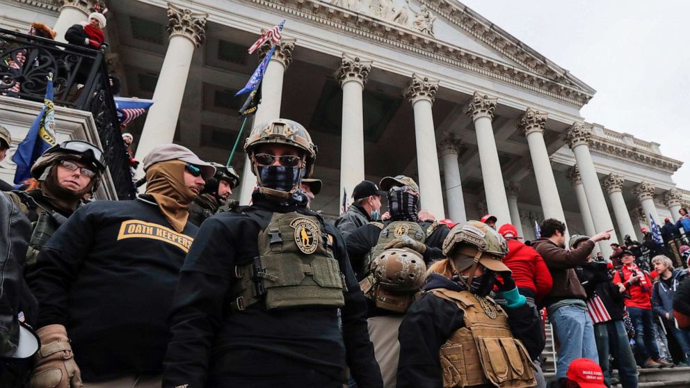 PHOTO: Members of the Oath Keepers militia group, including Jessica Marie Watkins, who has since been indicted by federal authorities for her role in the siege on the Capitol, stand on the east front steps of the U.S. Capitol, Jan. 6, 2021, in Washington.