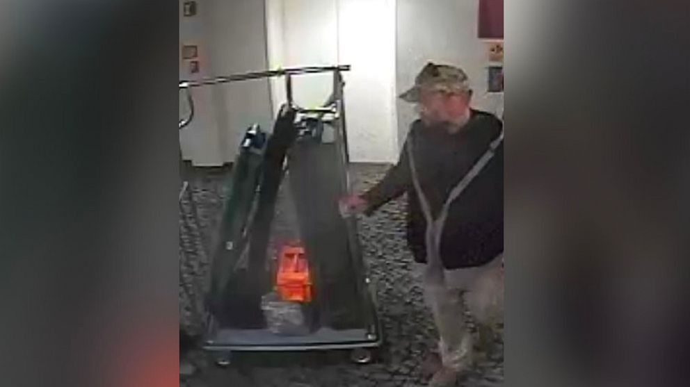 PHOTO: A screen grab from surveillance video released by prosecutors shows Kenneth Harrelson at the Comfort Inn Ballston in Arlington, Va.,"wheeling what appears to be at least one rifle case down a hallway," Jan. 7, 2020.