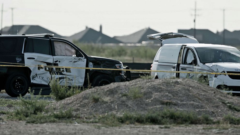 PHOTO: A city of Odessa police car, left, and a U.S. mail vehicle, right, which were involved in Saturday's shooting, are pictured outside the Cinergy entertainment center, Sept. 1, 2019, in Odessa, Texas. 